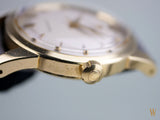 Omega 2577, 18K solid gold, unpolished condition with original unrestored two-tone dial